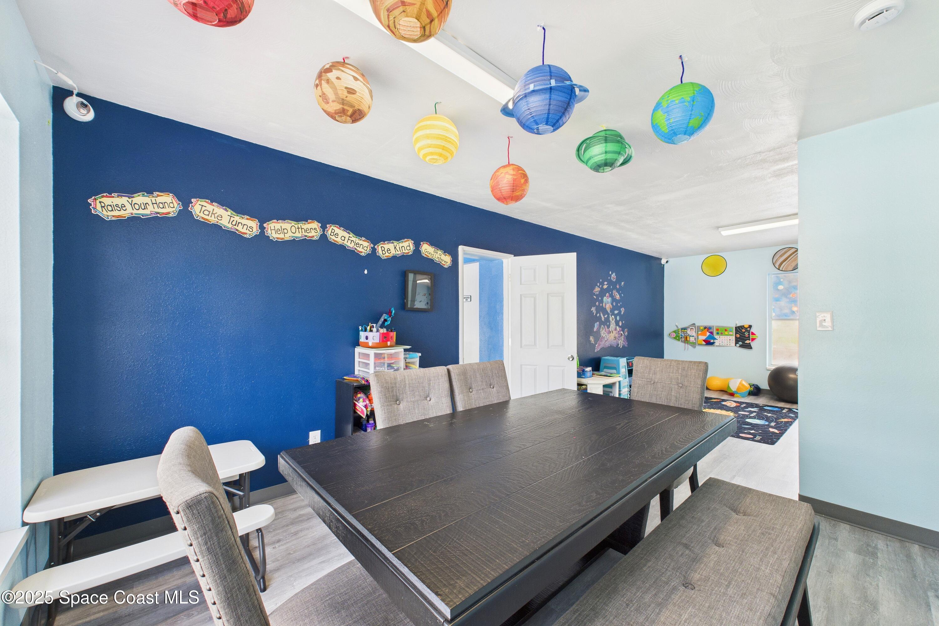 1340 South Wickham Road Melbourne, FL 32904 - Photo 25 of 50 a living room with furniture and a table