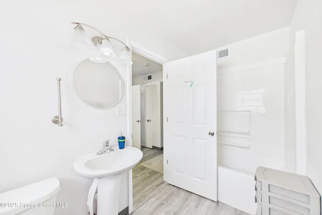 a view of yard with swimming pool and tall trees
