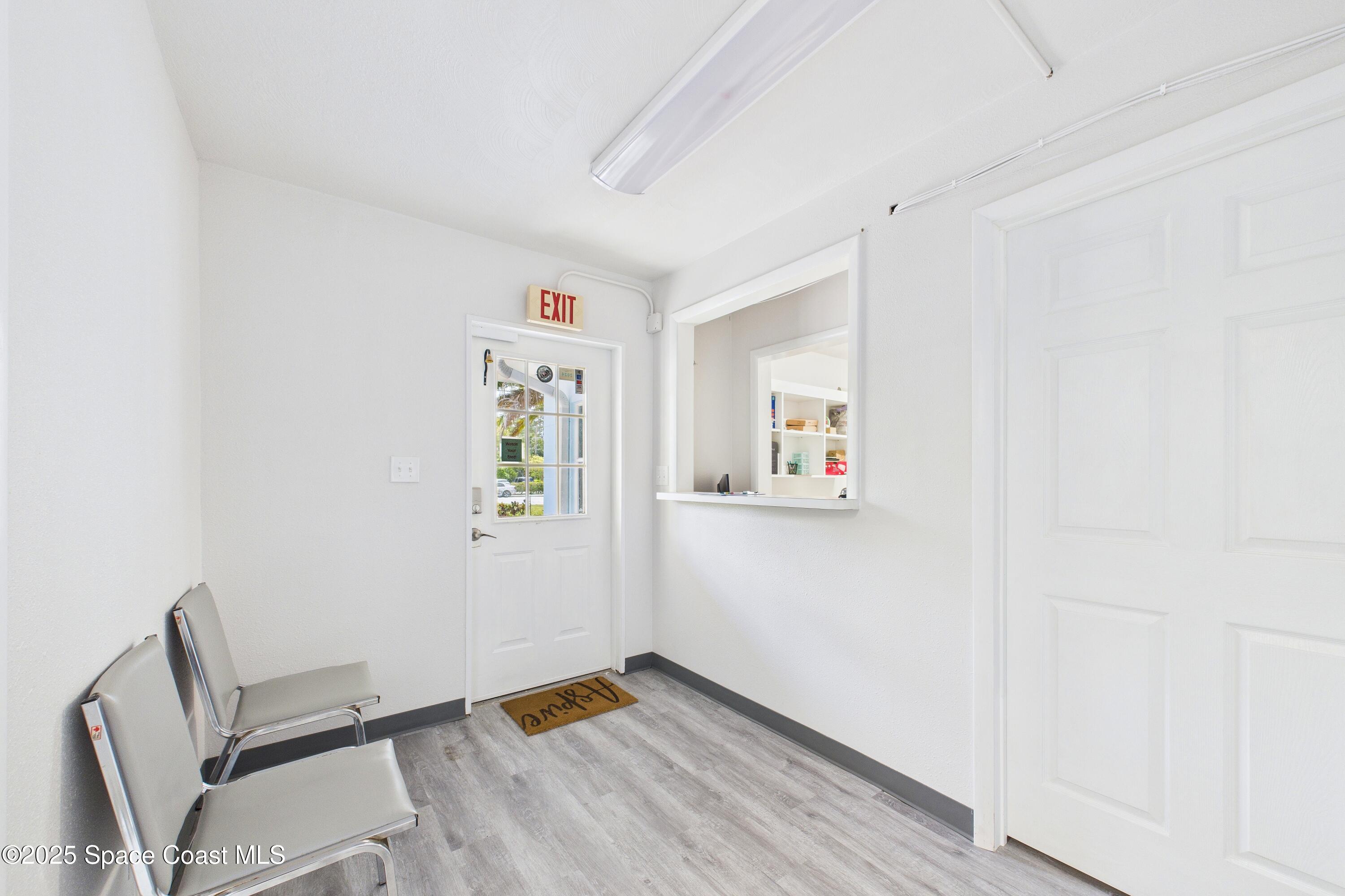 1340 South Wickham Road Melbourne, FL 32904 - Photo 3 of 50 a view of room with window and wooden floor