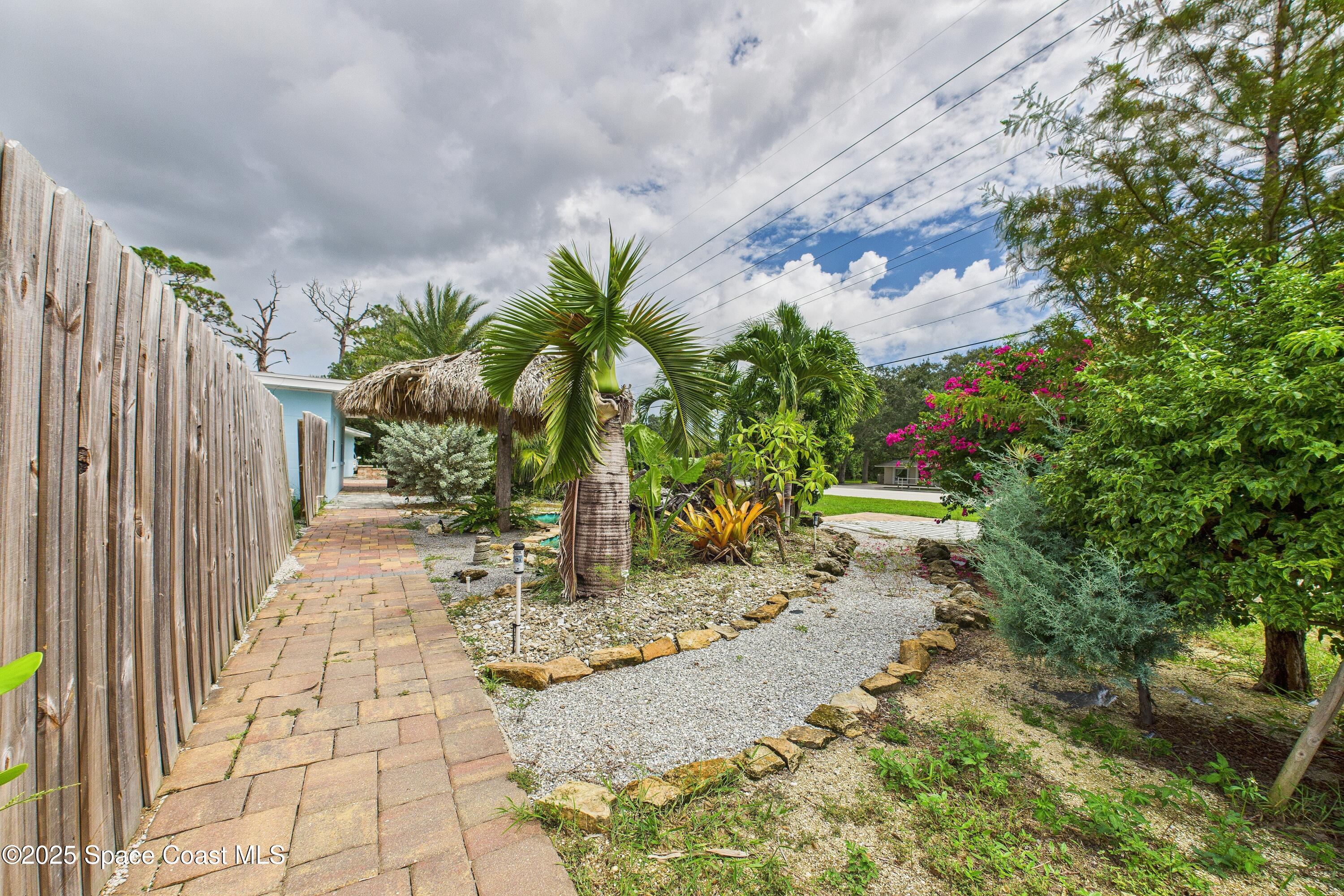1340 South Wickham Road Melbourne, FL 32904 - Photo 32 of 50 a view of a yard with plants