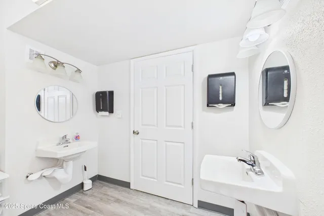 a kitchen with stainless steel appliances a refrigerator sink and cabinets