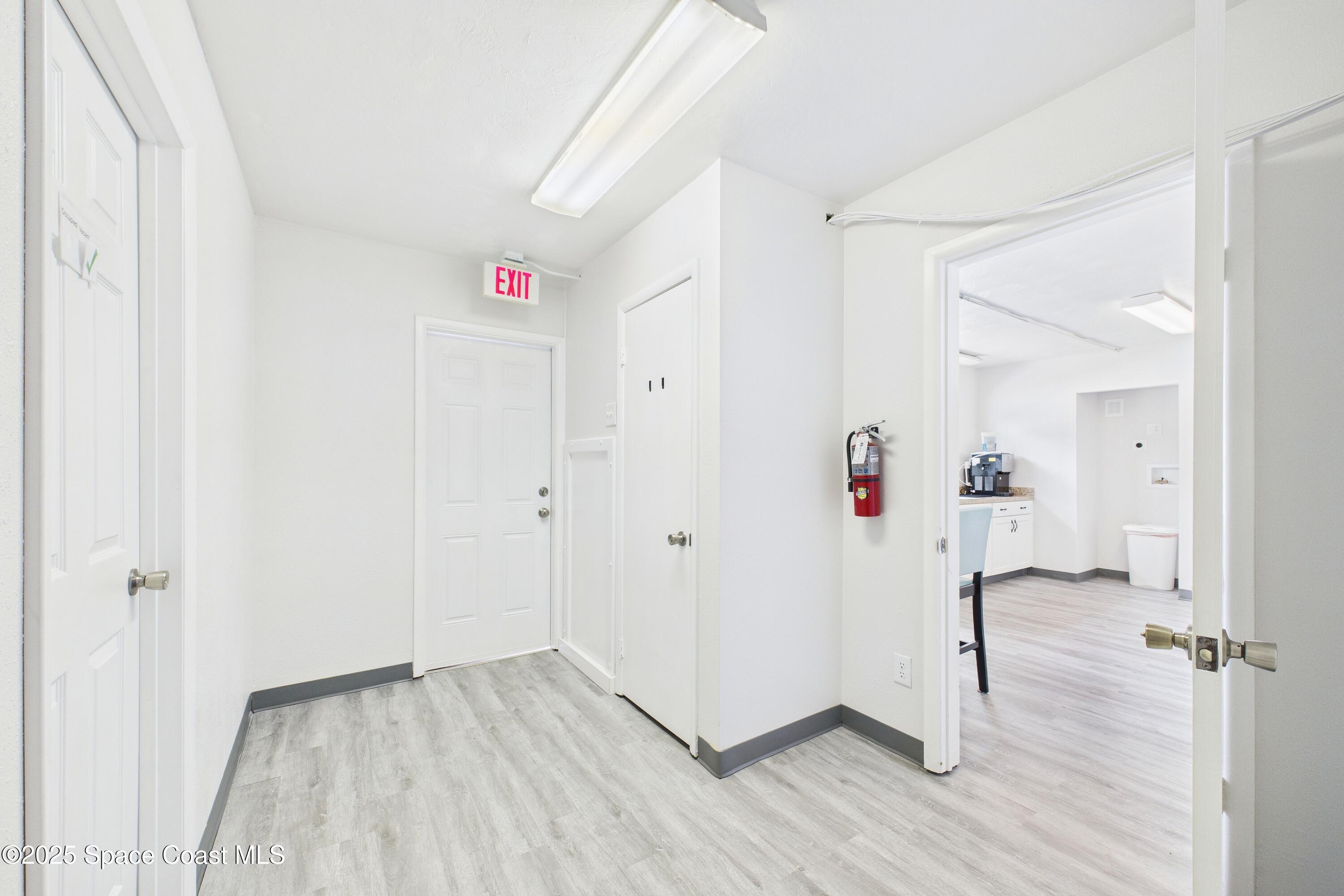 1340 South Wickham Road Melbourne, FL 32904 - Photo 4 of 50 a view of a hallway with wooden floor and closet area