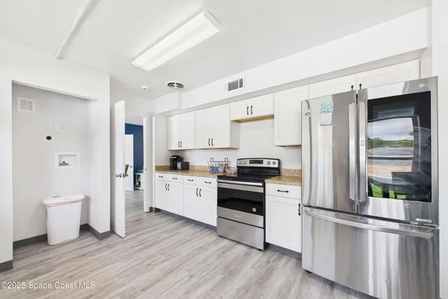 a room with furniture and a wooden floor