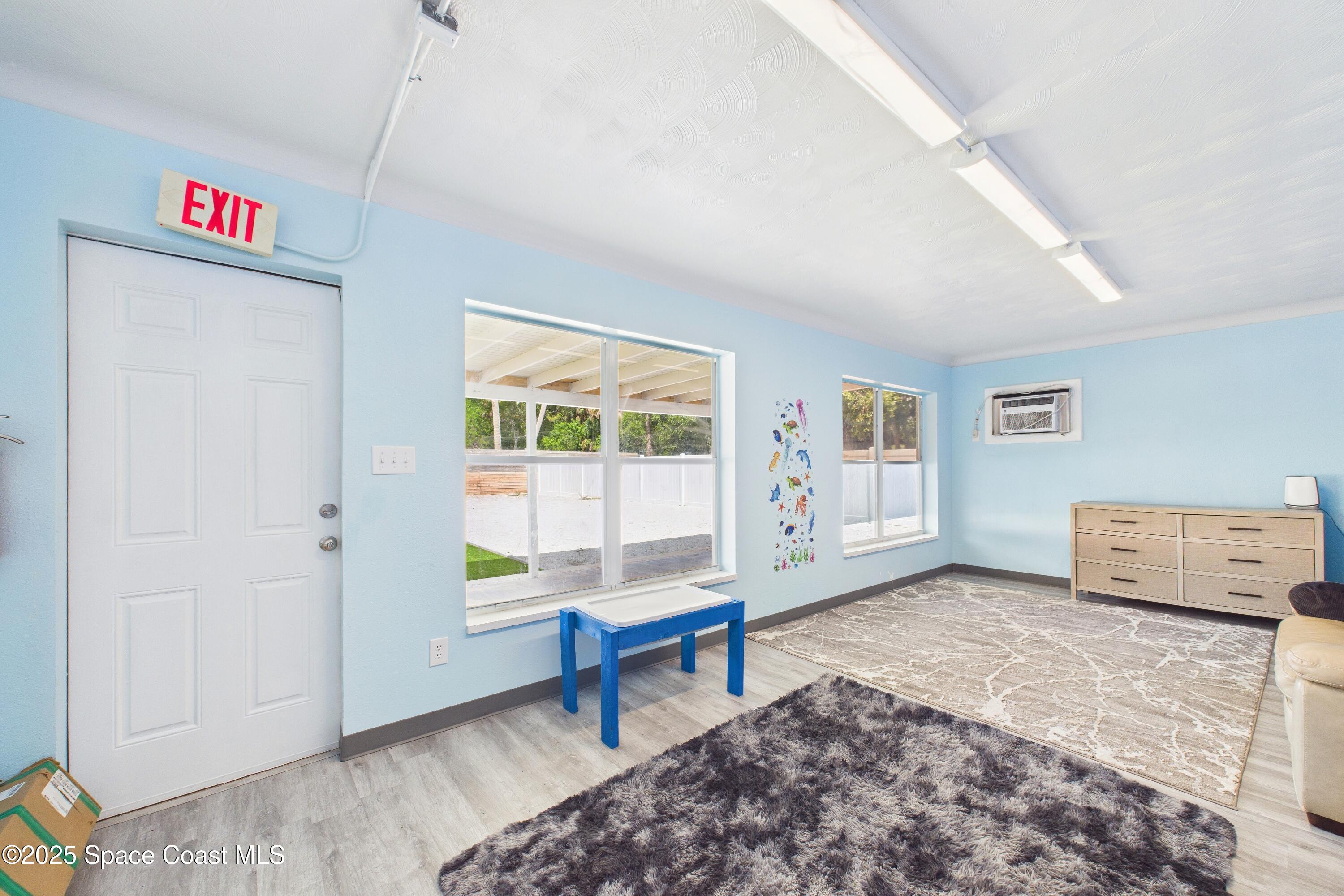 1340 South Wickham Road Melbourne, FL 32904 - Photo 42 of 50 a living room with furniture and a window