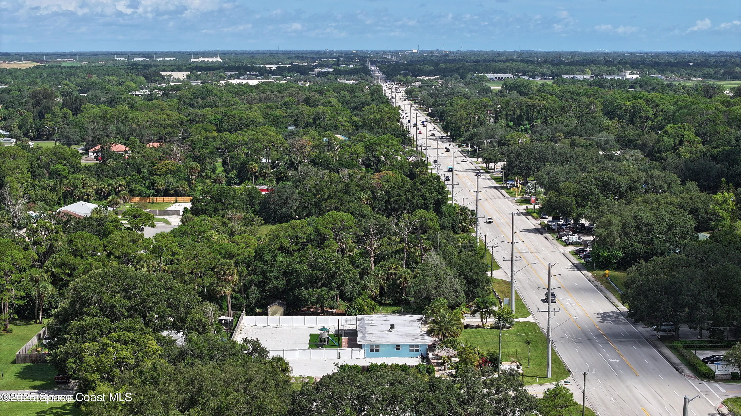 1340 South Wickham Road Melbourne, FL 32904 - Photo 50 of 50 an aerial view of a house with a yard