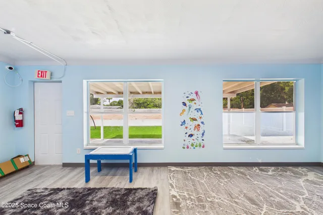 a view of an empty room and window