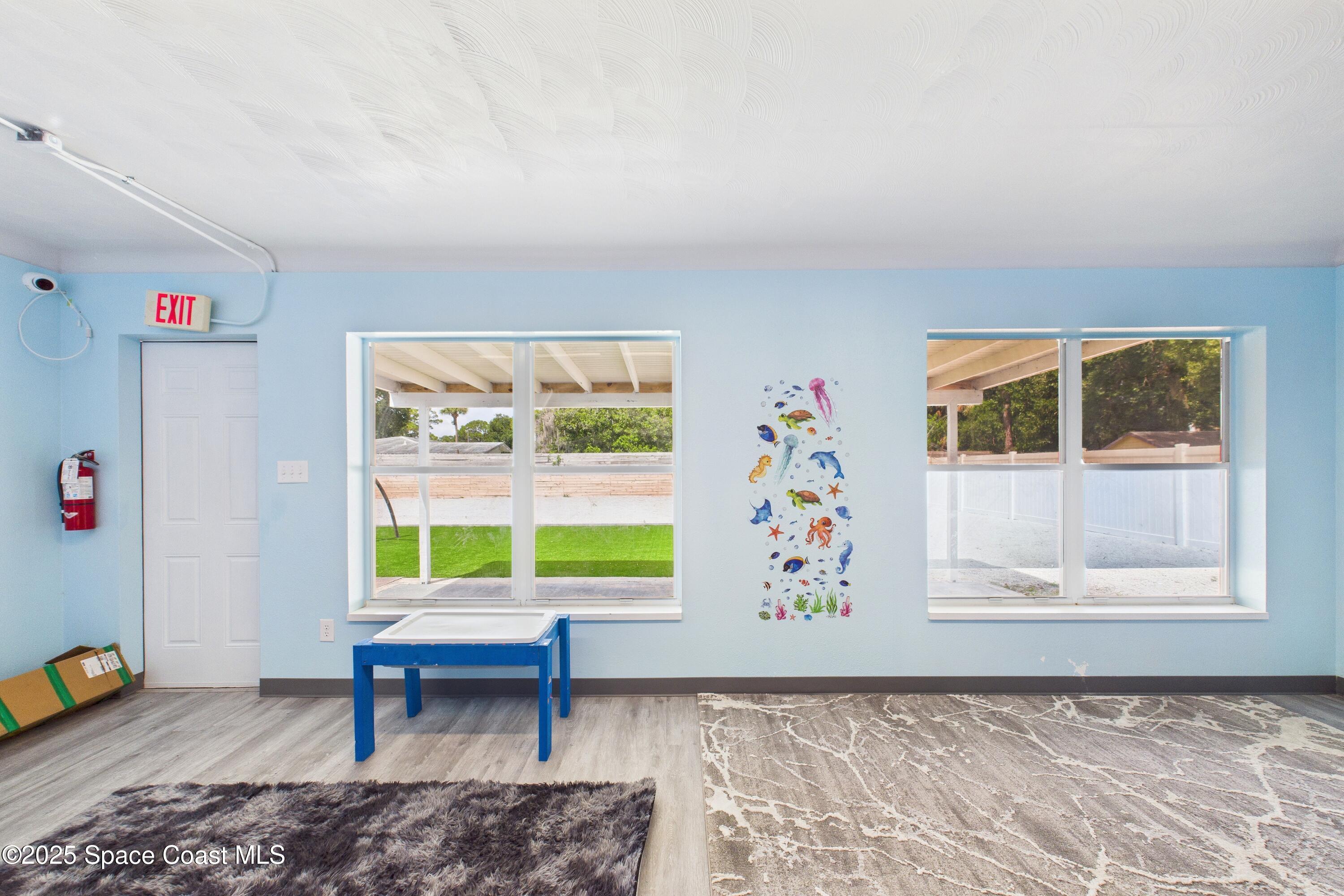 1340 South Wickham Road Melbourne, FL 32904 - Photo 8 of 50 a view of an empty room and window