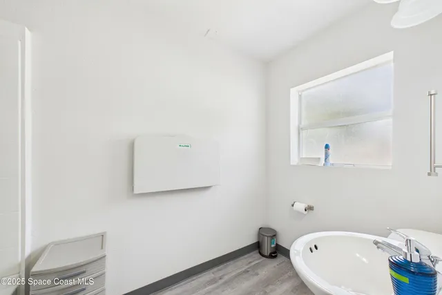 a bathroom with a toilet and a tub