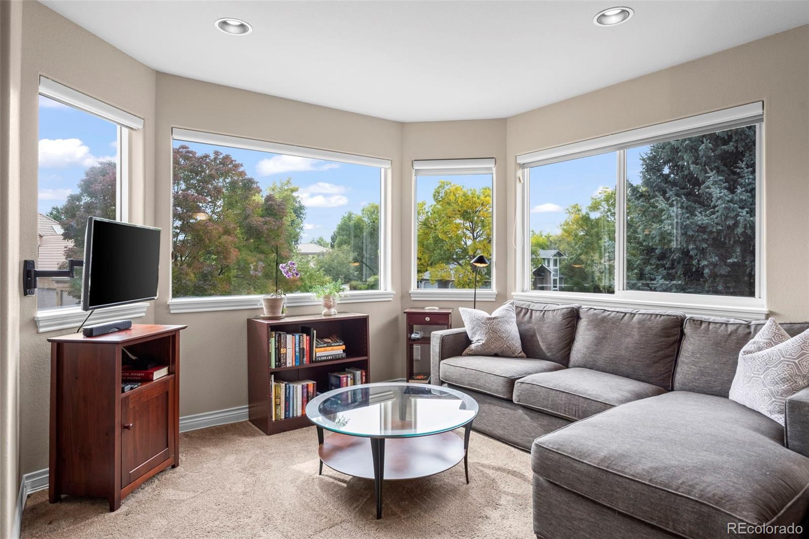 5236 Pinehurst Drive Boulder, CO 80301 - Photo 18 of 40 a living room with furniture and a flat screen tv
