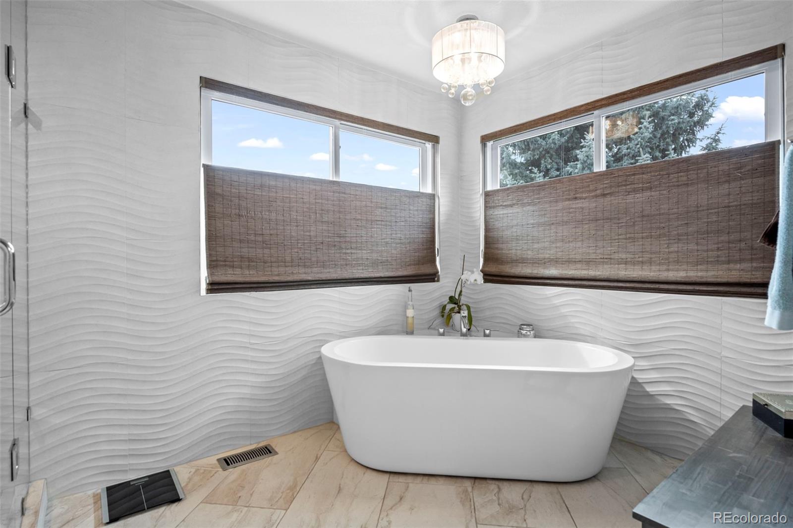 5236 Pinehurst Drive Boulder, CO 80301 - Photo 21 of 40 a white bath tub sitting in a bathroom