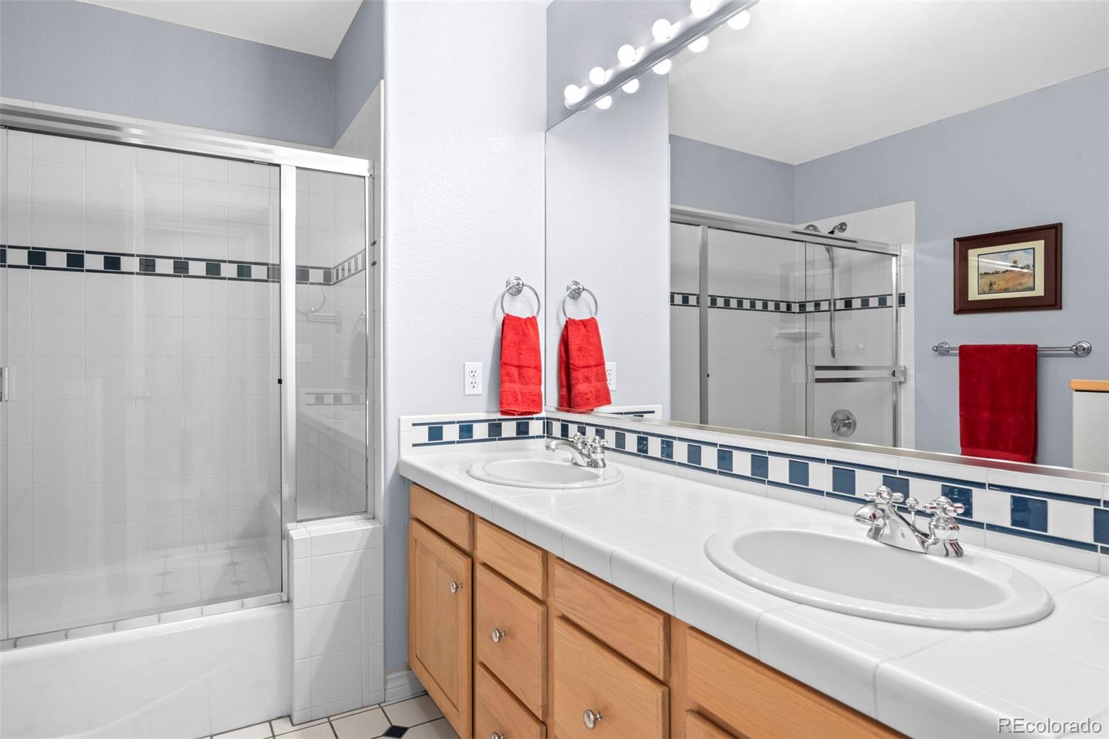 5236 Pinehurst Drive Boulder, CO 80301 - Photo 25 of 40 a bathroom with a sink and a mirror