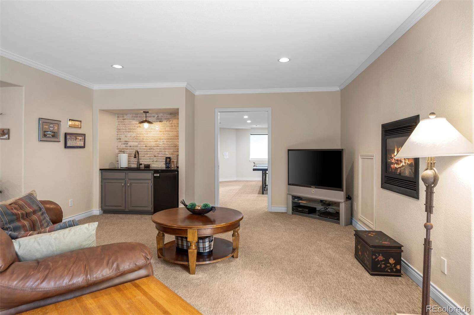 5236 Pinehurst Drive Boulder, CO 80301 - Photo 32 of 40 a living room with furniture and a flat screen tv