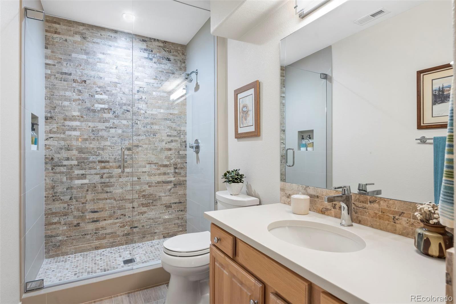 5236 Pinehurst Drive Boulder, CO 80301 - Photo 36 of 40 a bathroom with a sink a toilet and shower