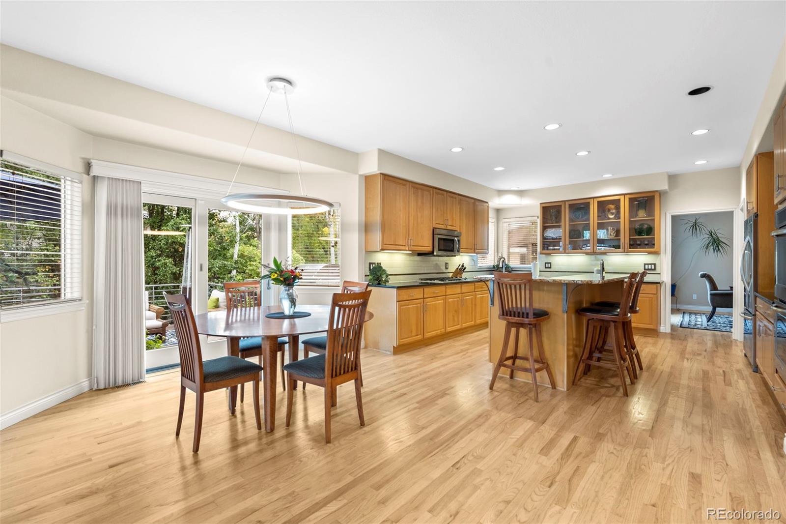 5236 Pinehurst Drive Boulder, CO 80301 - Photo 9 of 40 a view of a dining room with furniture window and wooden floor