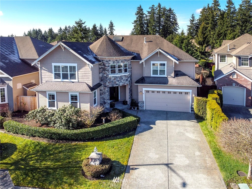20706 37th Avenue Southeast Bothell, WA 98021 - Photo 1 of 32 a front view of house with yard and green space