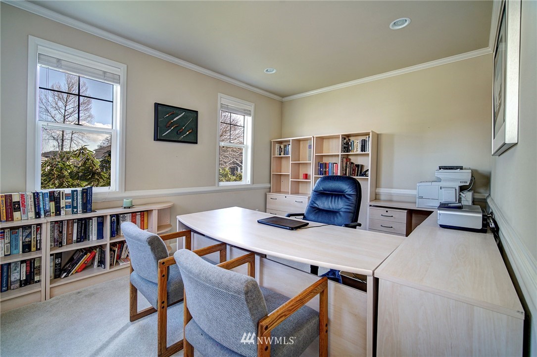 20706 37th Avenue Southeast Bothell, WA 98021 - Photo 11 of 32 a living room with furniture a bookshelf and a window