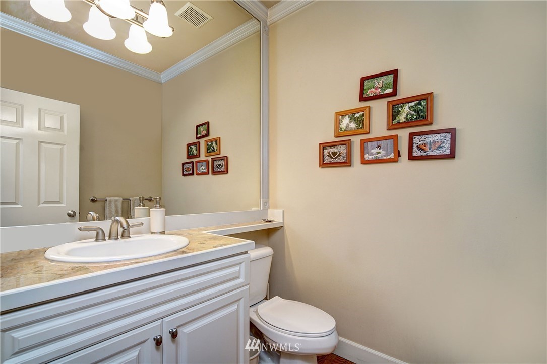 20706 37th Avenue Southeast Bothell, WA 98021 - Photo 14 of 32 a bathroom with a sink mirror and toilet