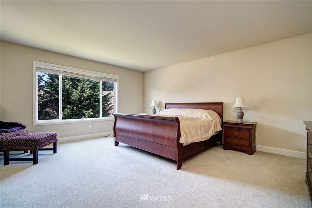 20706 37th Avenue Southeast Bothell, WA 98021 - Photo 15 of 32 a bedroom with a bed and a window