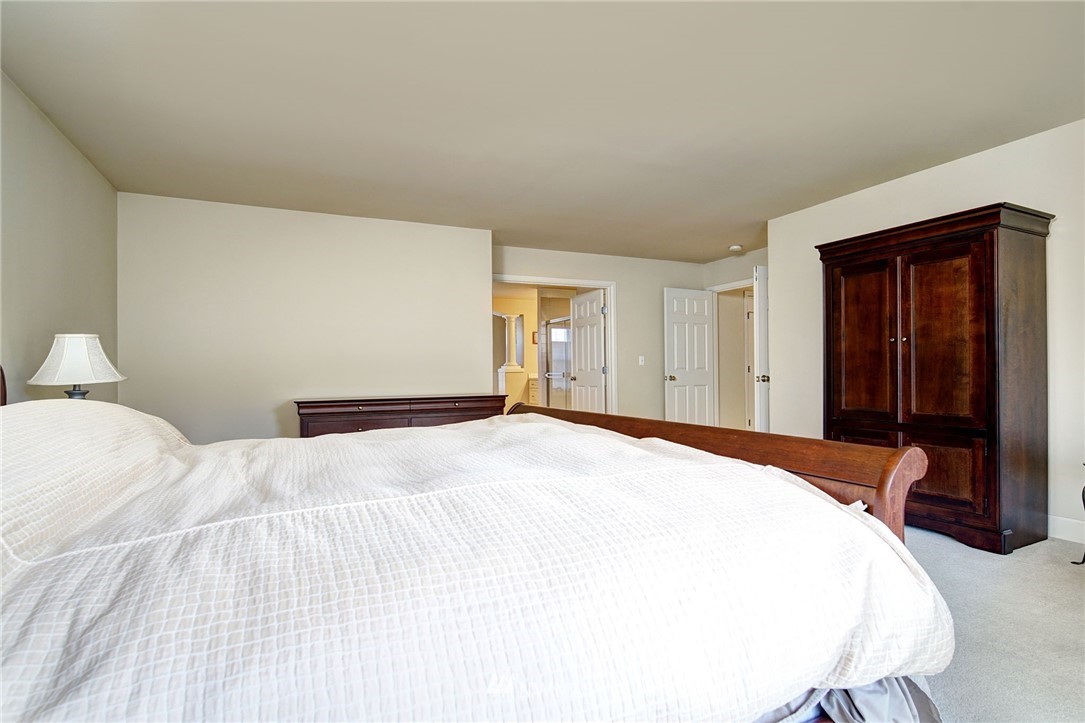 20706 37th Avenue Southeast Bothell, WA 98021 - Photo 16 of 32 a bedroom with a bed and a closet