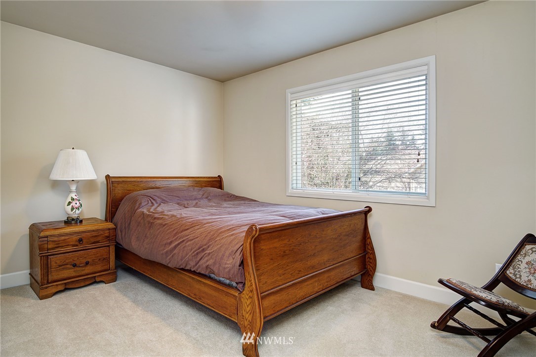 20706 37th Avenue Southeast Bothell, WA 98021 - Photo 21 of 32 a bedroom with a bed and a window