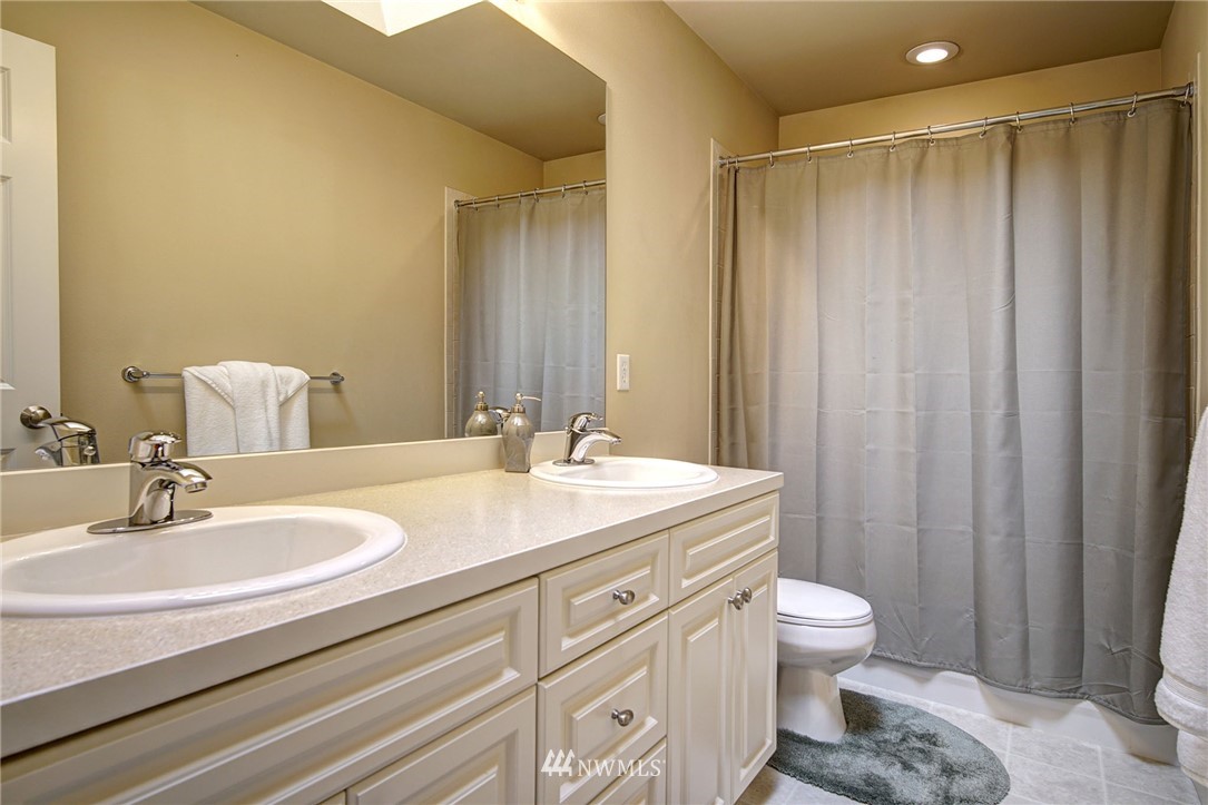 20706 37th Avenue Southeast Bothell, WA 98021 - Photo 22 of 32 a bathroom with a sink a toilet and shower