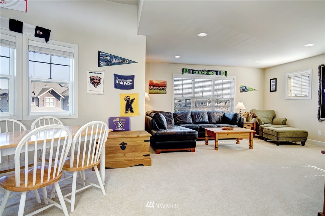 20706 37th Avenue Southeast Bothell, WA 98021 - Photo 25 of 32 a living room with furniture and a couch