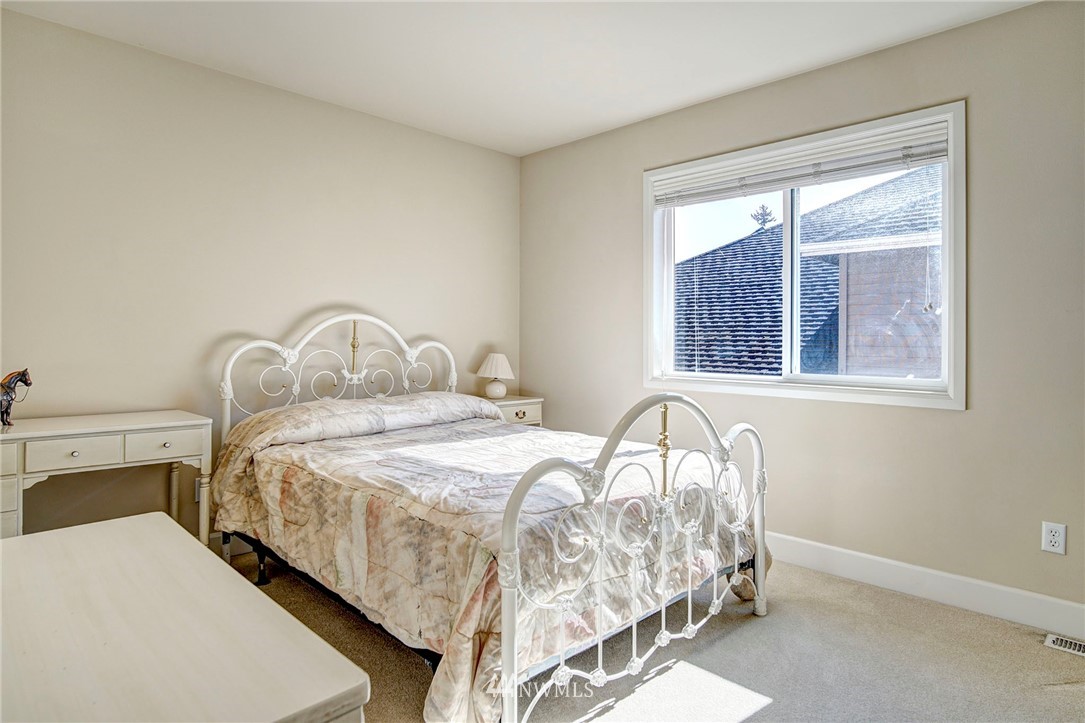 20706 37th Avenue Southeast Bothell, WA 98021 - Photo 28 of 32 a bedroom with a bed and a window