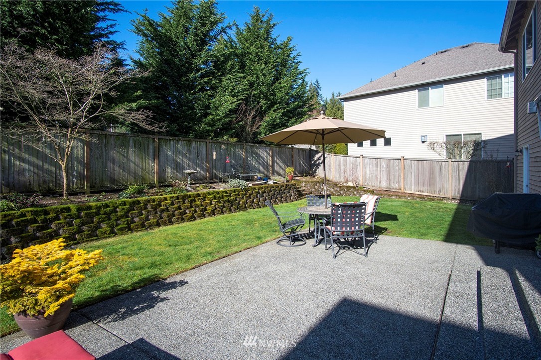 20706 37th Avenue Southeast Bothell, WA 98021 - Photo 30 of 32 a view of a patio with a table and chairs