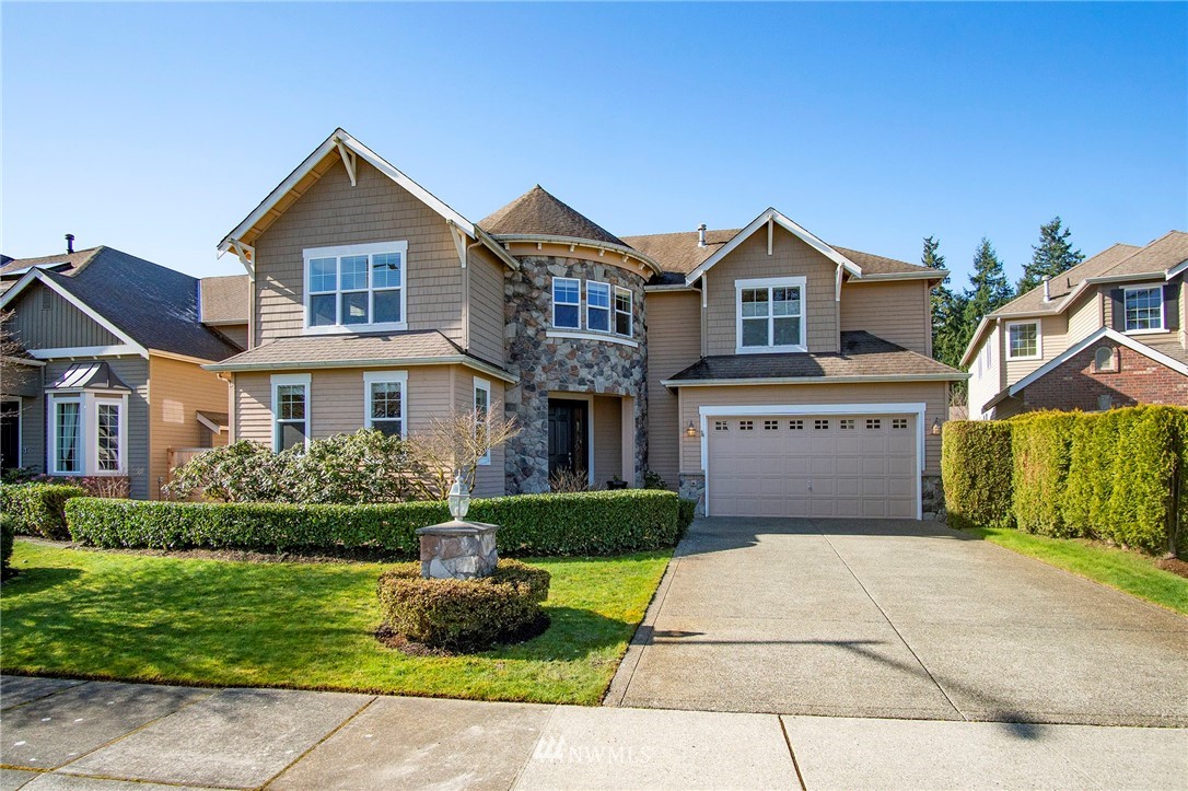 20706 37th Avenue Southeast Bothell, WA 98021 - Photo 32 of 32 a front view of a house with a yard and garage