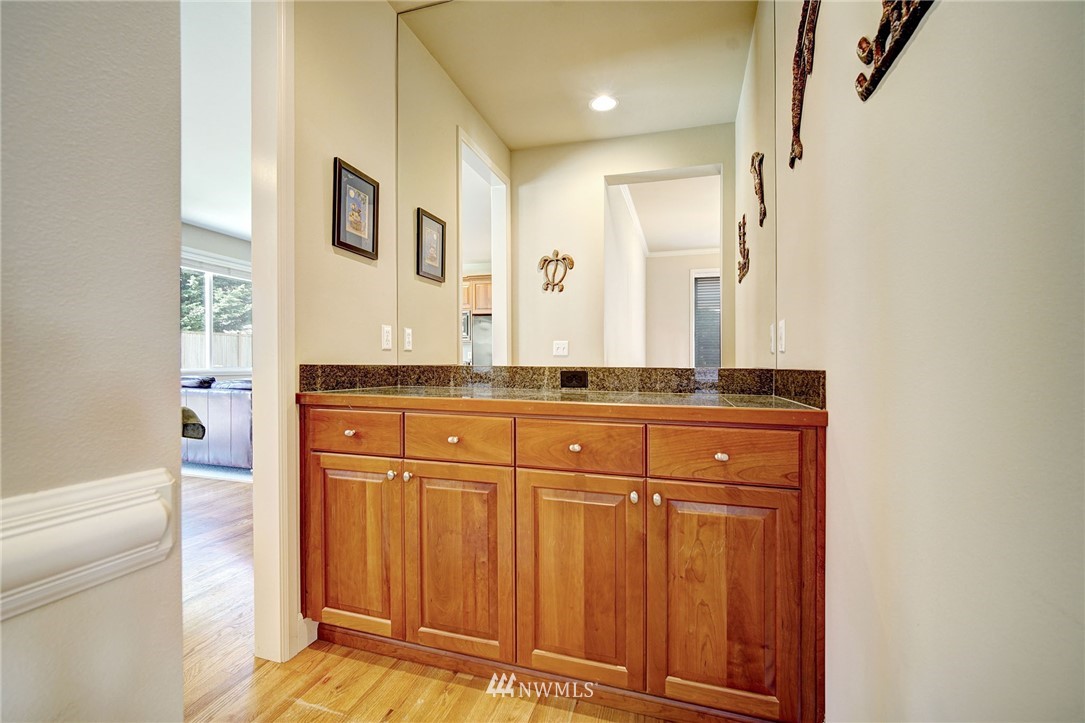 20706 37th Avenue Southeast Bothell, WA 98021 - Photo 6 of 32 a bathroom with a granite countertop sink and a mirror