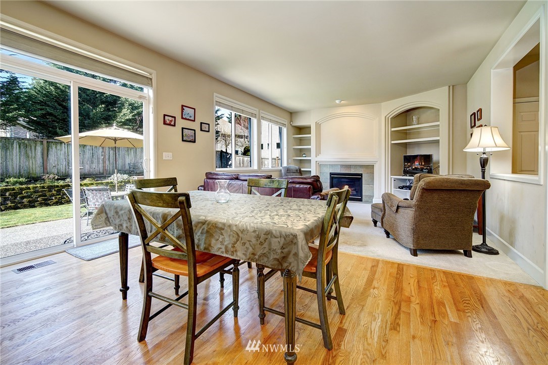 20706 37th Avenue Southeast Bothell, WA 98021 - Photo 8 of 32 a view of a dining room with furniture window and wooden floor