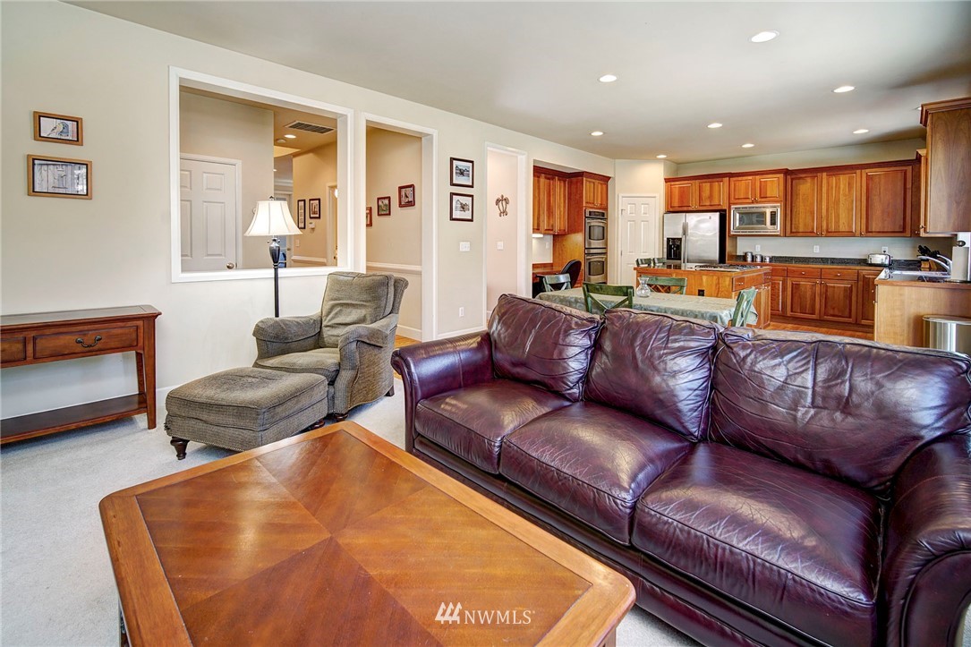 20706 37th Avenue Southeast Bothell, WA 98021 - Photo 9 of 32 a living room with furniture and a large window