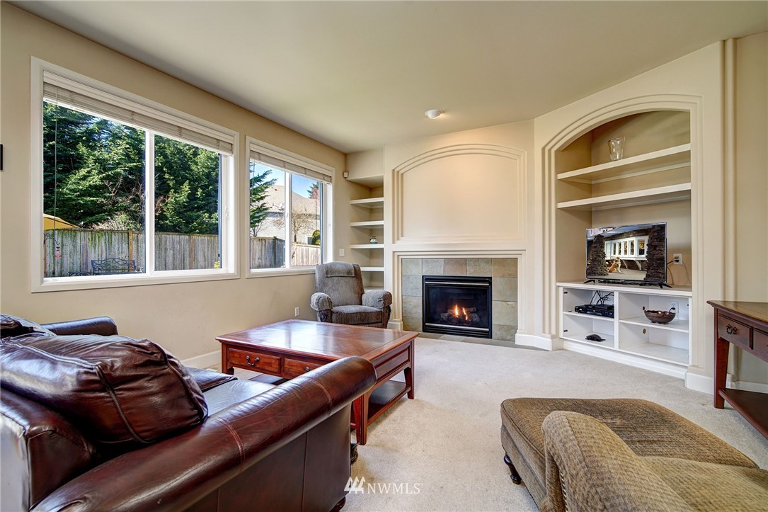 20706 37th Avenue Southeast Bothell, WA 98021 - Photo 10 of 32 a living room with furniture window and fireplace
