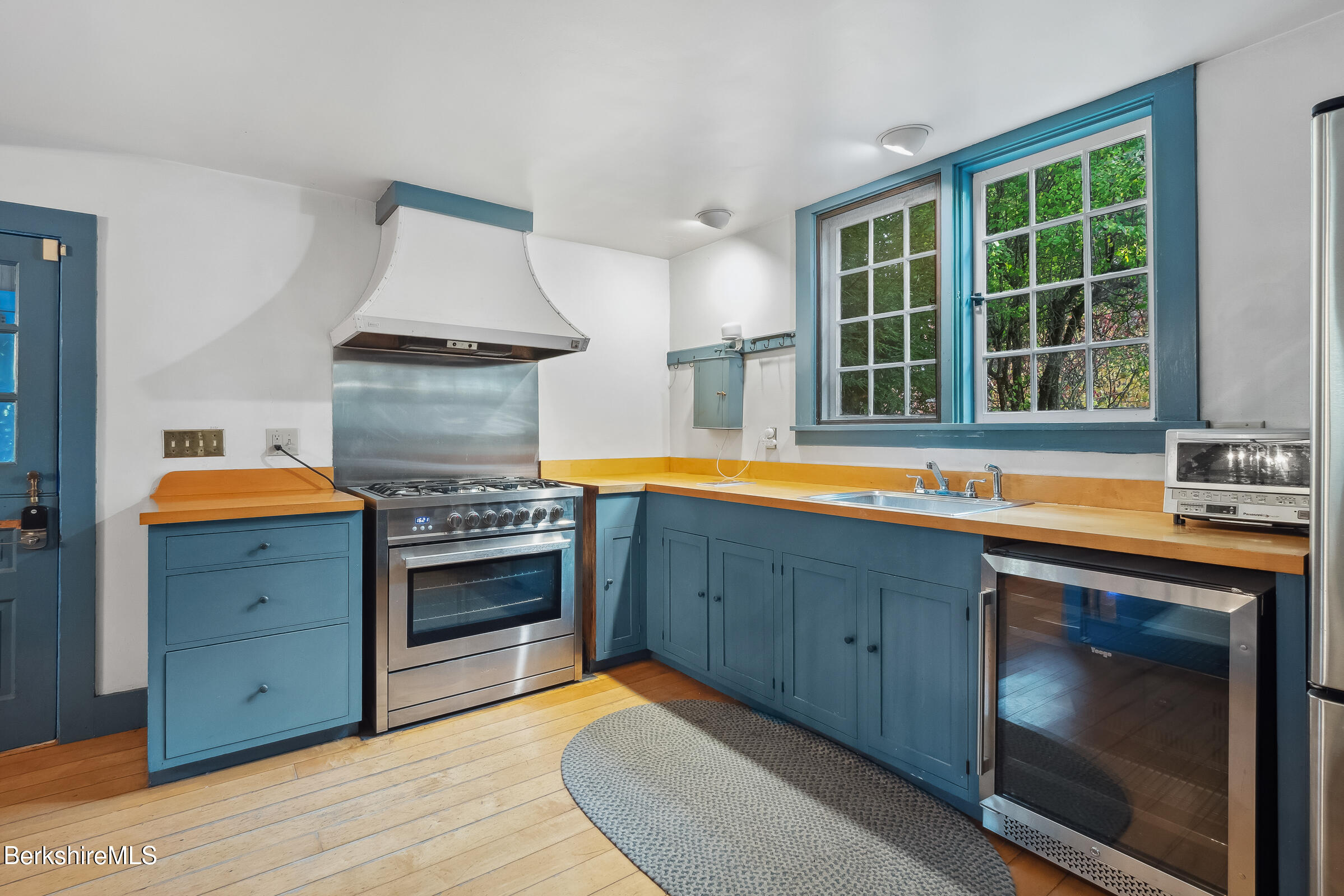 82 East Main Street Stockbridge, MA 01262 - Photo 13 of 52 a kitchen with stainless steel appliances granite countertop a stove and a sink