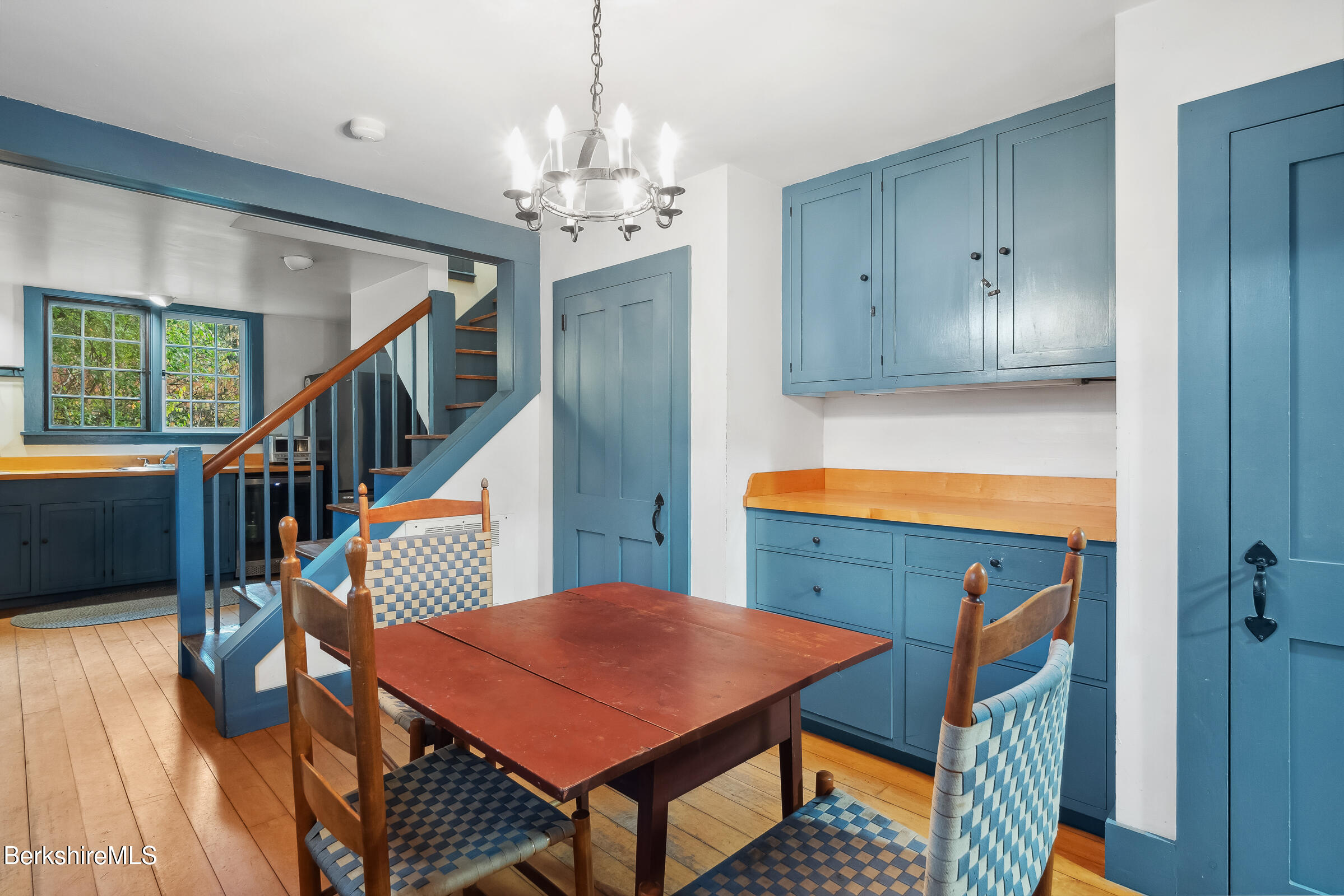 82 East Main Street Stockbridge, MA 01262 - Photo 14 of 52 a view of a dining room with furniture a chandelier and wooden floor