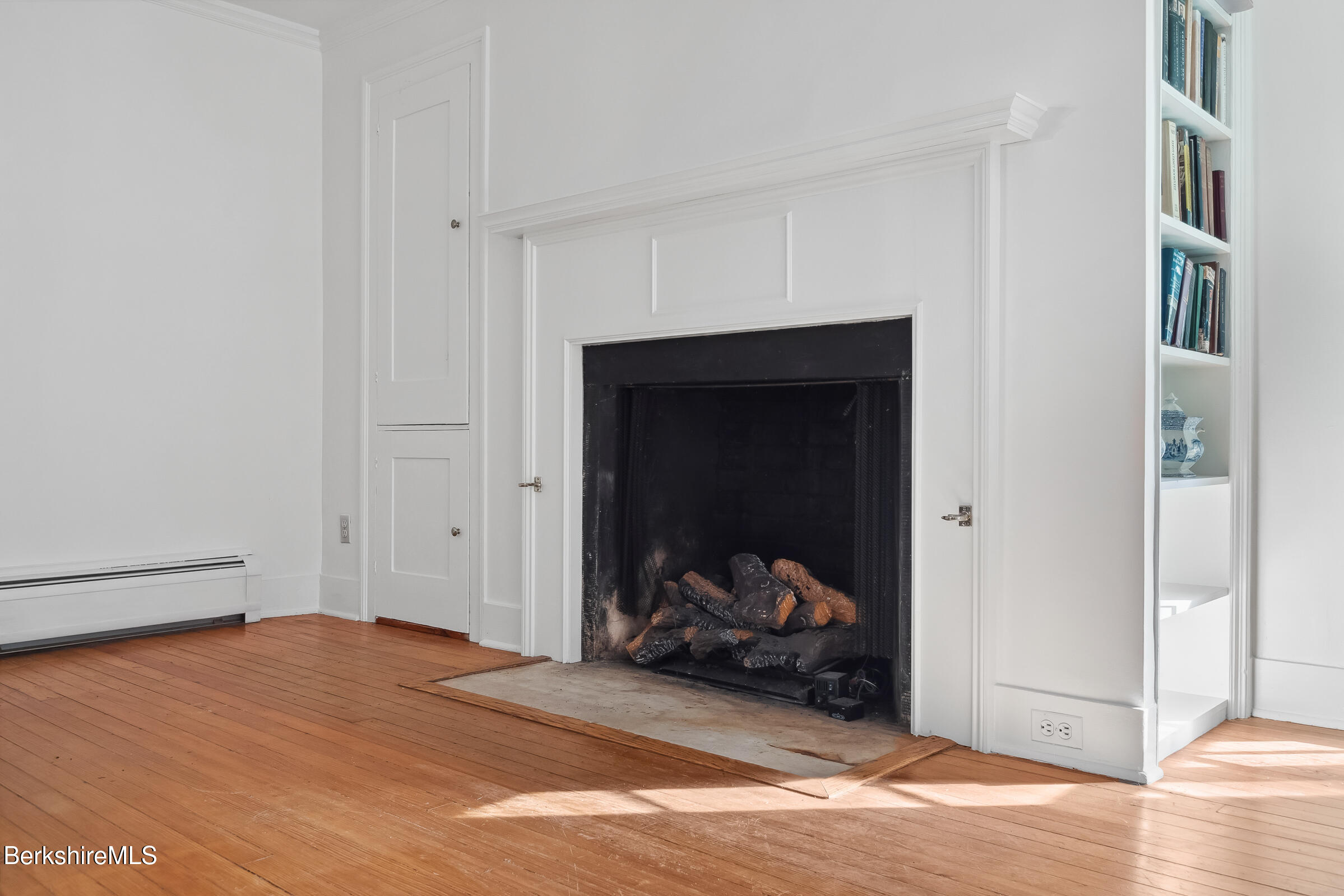 82 East Main Street Stockbridge, MA 01262 - Photo 20 of 52 a bedroom with a bed and wooden floor