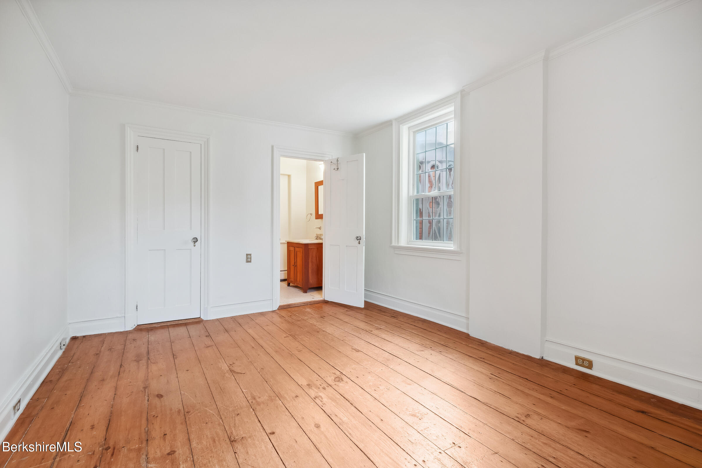 82 East Main Street Stockbridge, MA 01262 - Photo 25 of 52 a view of empty room with wooden floor and fan