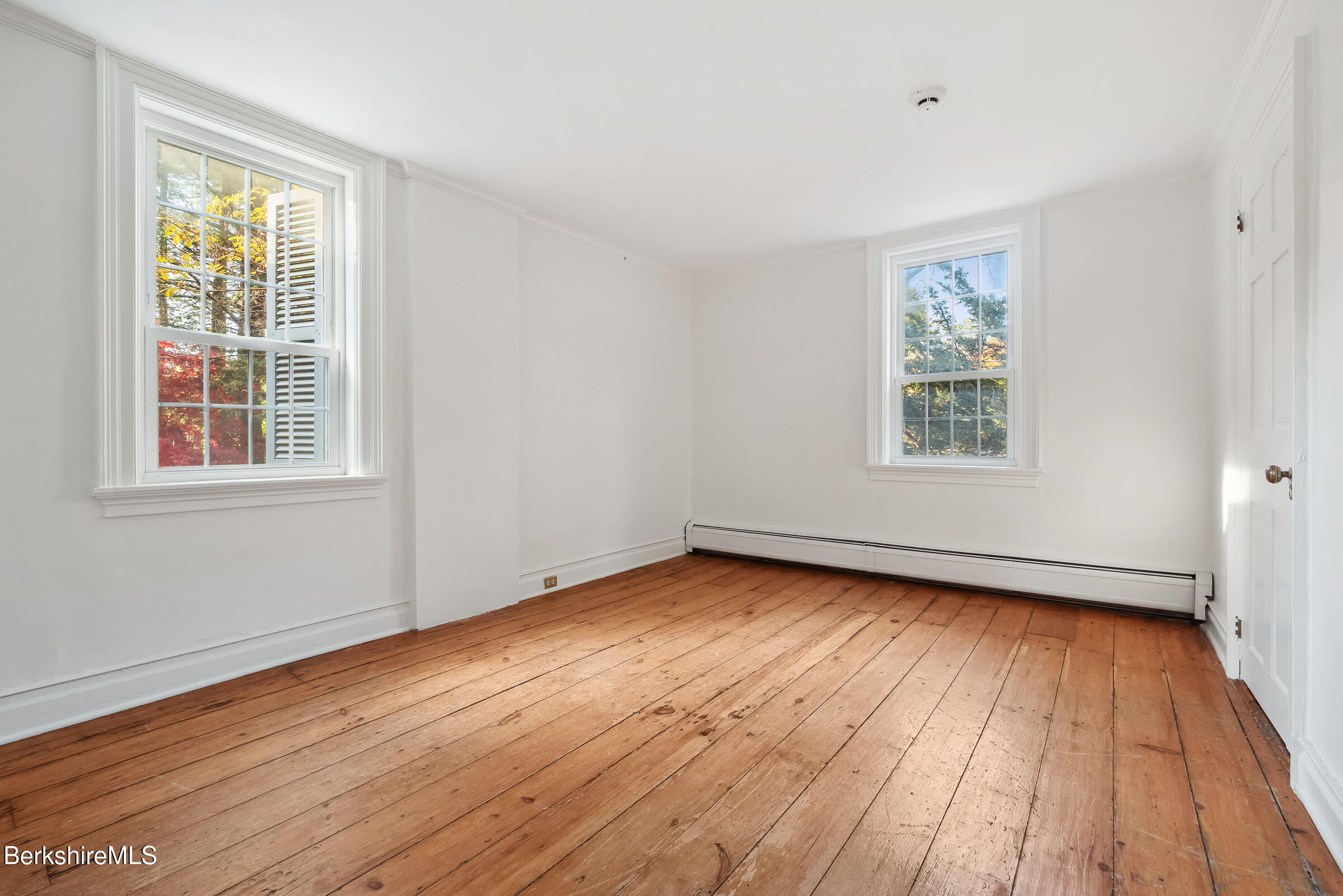 82 East Main Street Stockbridge, MA 01262 - Photo 26 of 52 a view of an empty room with wooden floor and a window