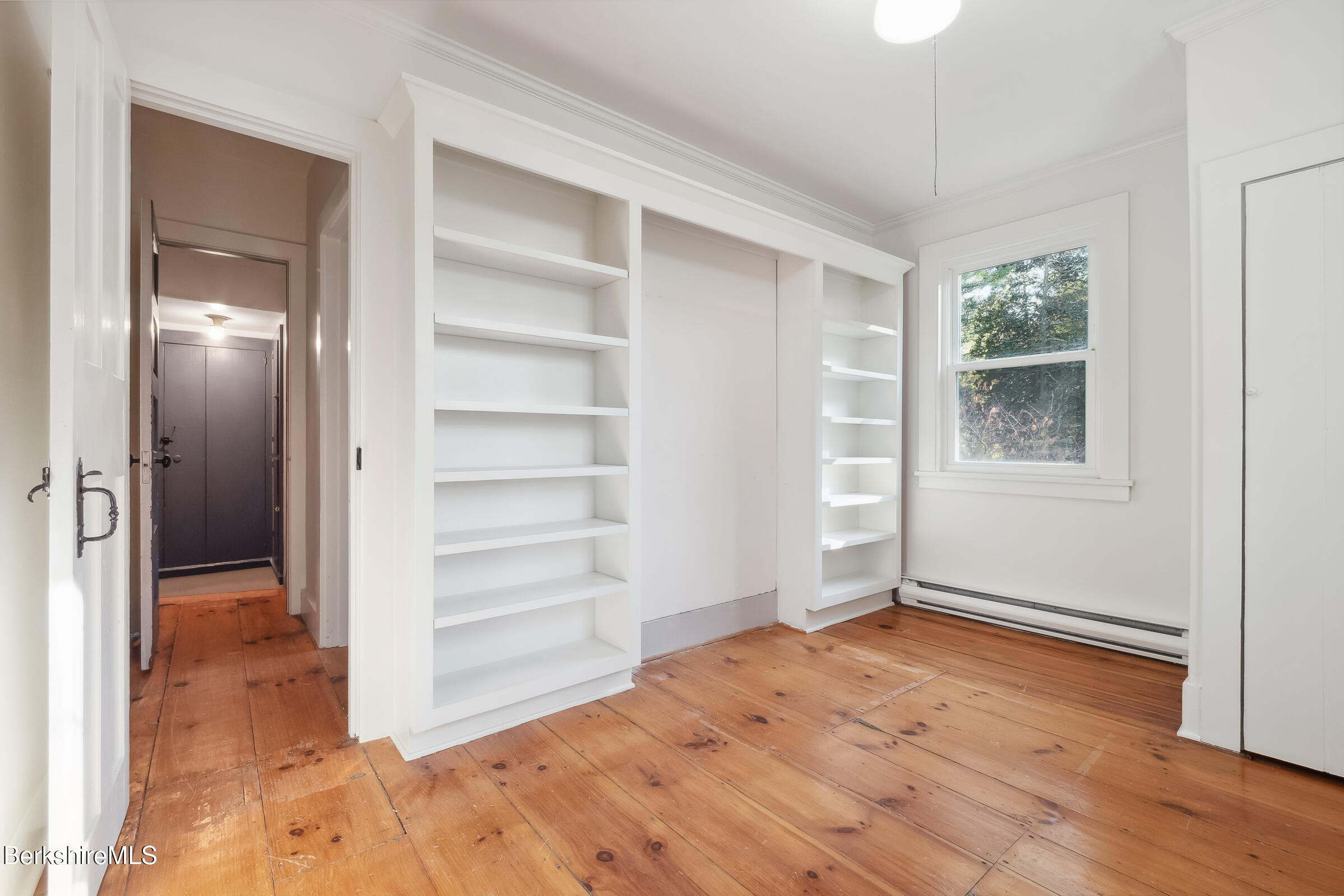82 East Main Street Stockbridge, MA 01262 - Photo 34 of 52 a view of empty room with wooden floor and window