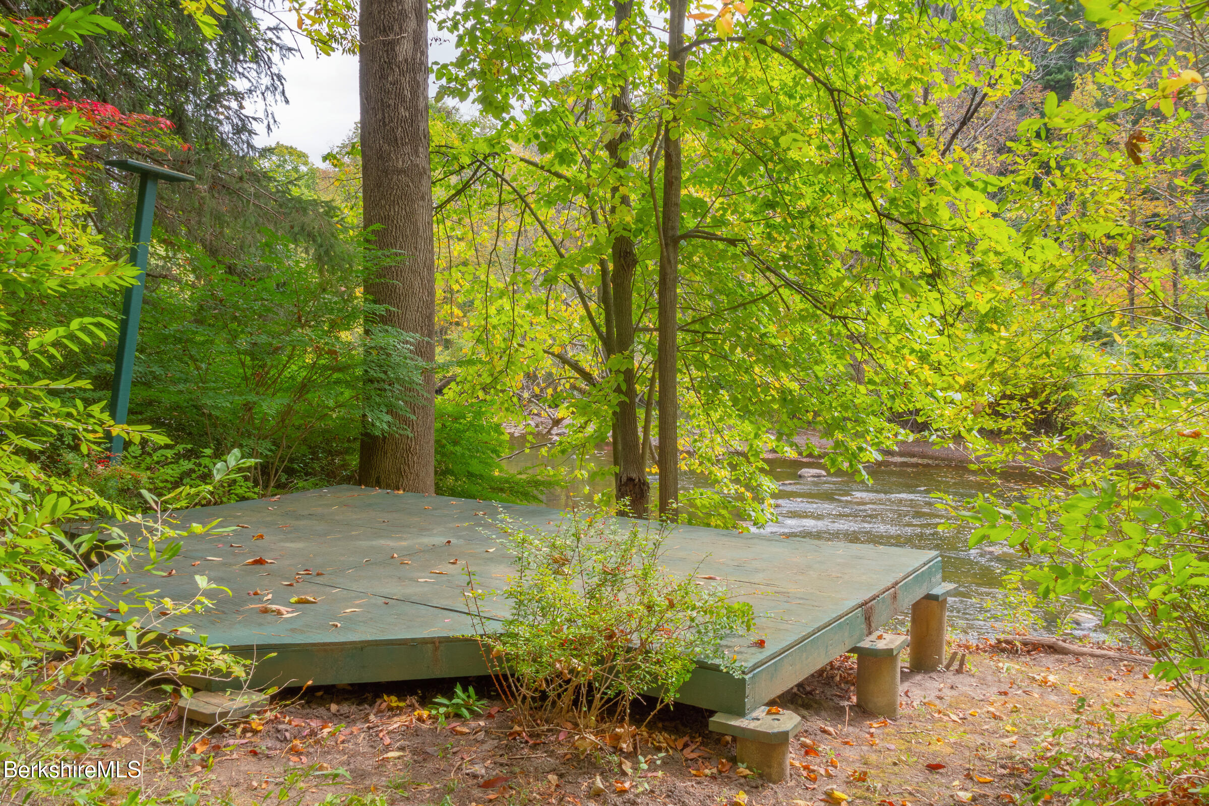 82 East Main Street Stockbridge, MA 01262 - Photo 45 of 52 a view of a backyard with plants and large trees