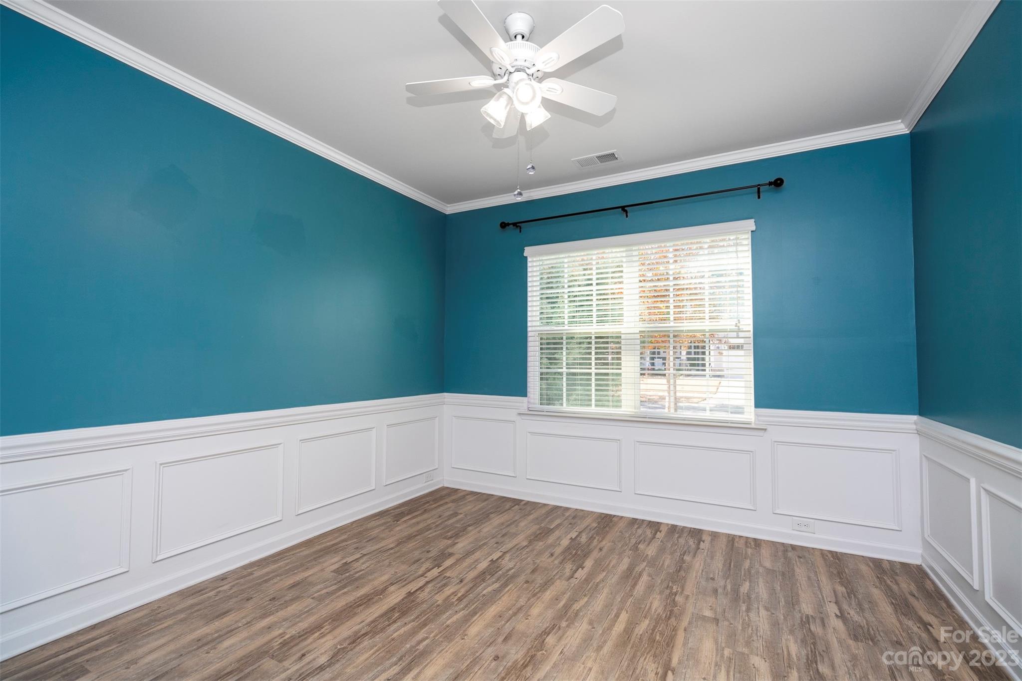 8202 Asher Chase Trail Lancaster, SC 29720 - Photo 11 of 42 a view of an empty room with window and wooden floor