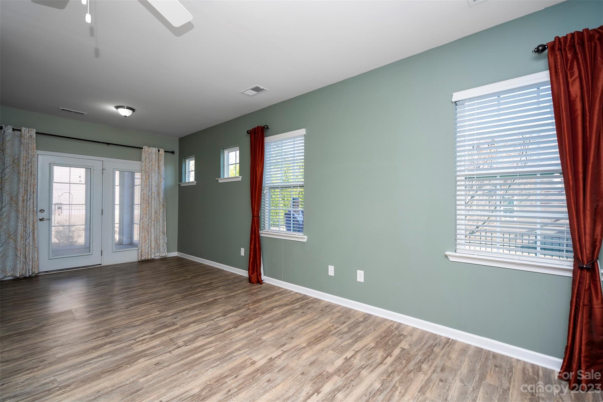 8202 Asher Chase Trail Lancaster, SC 29720 - Photo 21 of 42 a view of an empty room with wooden floor and a window