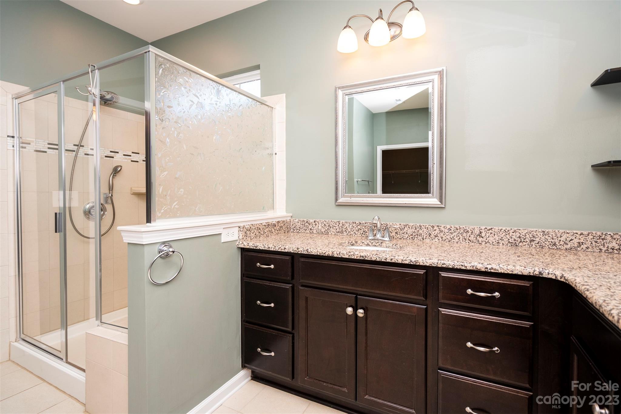 8202 Asher Chase Trail Lancaster, SC 29720 - Photo 26 of 42 a bathroom with a sink and a mirror