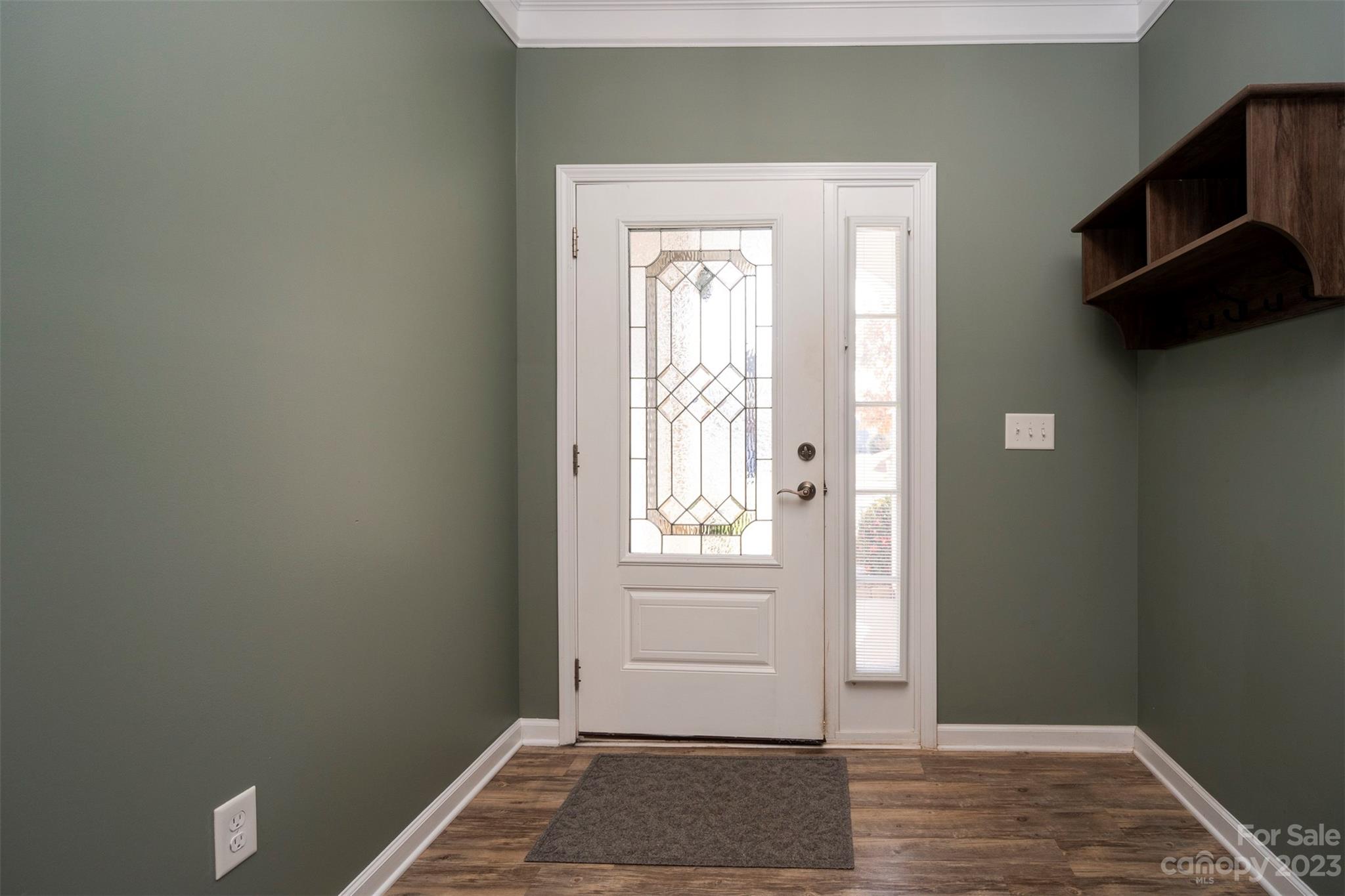 8202 Asher Chase Trail Lancaster, SC 29720 - Photo 5 of 42 a view of an empty room with wooden floor and a window