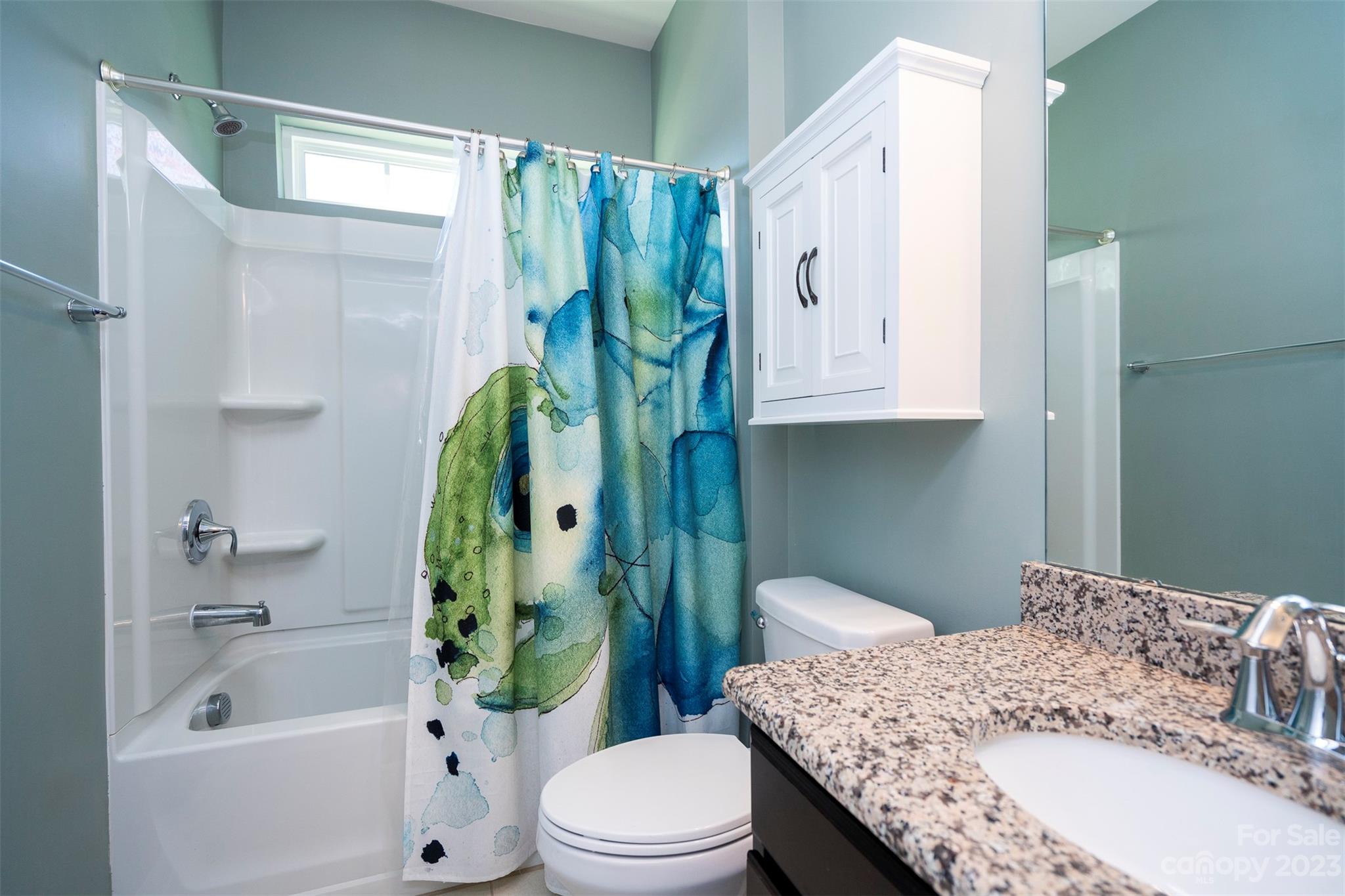8202 Asher Chase Trail Lancaster, SC 29720 - Photo 8 of 42 a bathroom with a granite countertop toilet a sink and bathtub