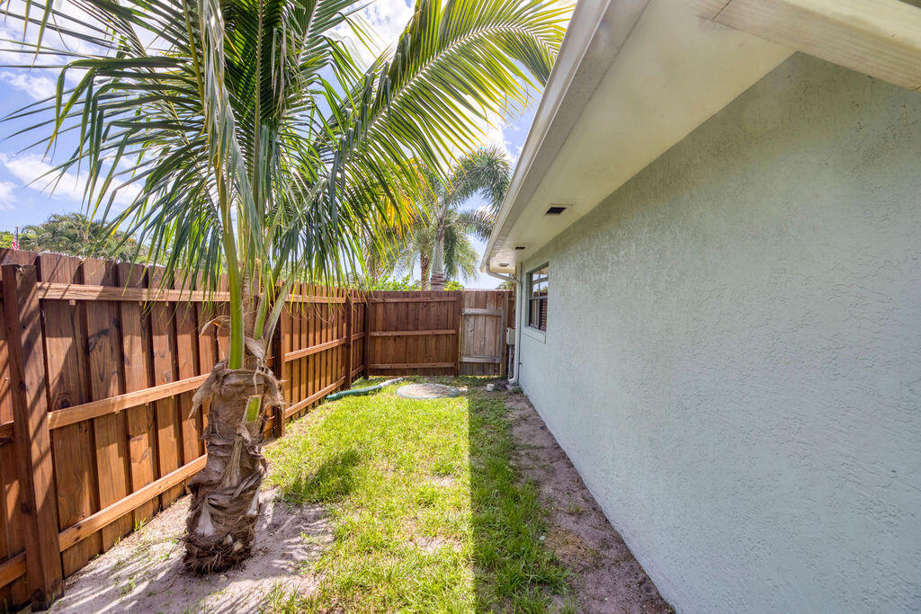 2402 Southeast Pinero Road Port St. Lucie, FL 34952 - Photo 11 of 45 a view of swimming pool with a garden