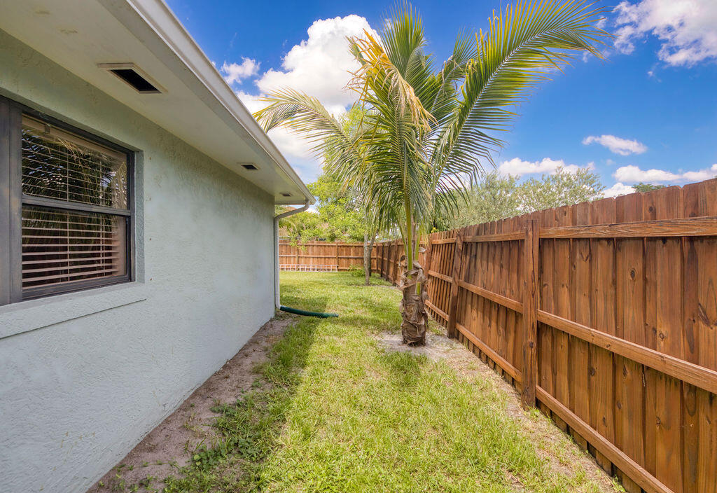 2402 Southeast Pinero Road Port St. Lucie, FL 34952 - Photo 12 of 45 a view of a backyard