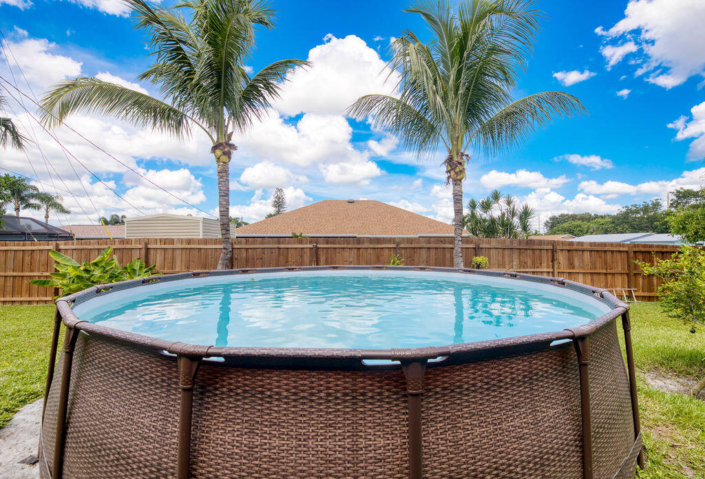 2402 Southeast Pinero Road Port St. Lucie, FL 34952 - Photo 13 of 45 a view of outdoor space with swimming pool