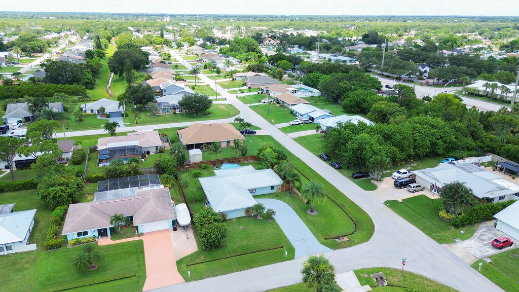 2402 Southeast Pinero Road Port St. Lucie, FL 34952 - Photo 16 of 45 an aerial view of residential houses with outdoor space and street view