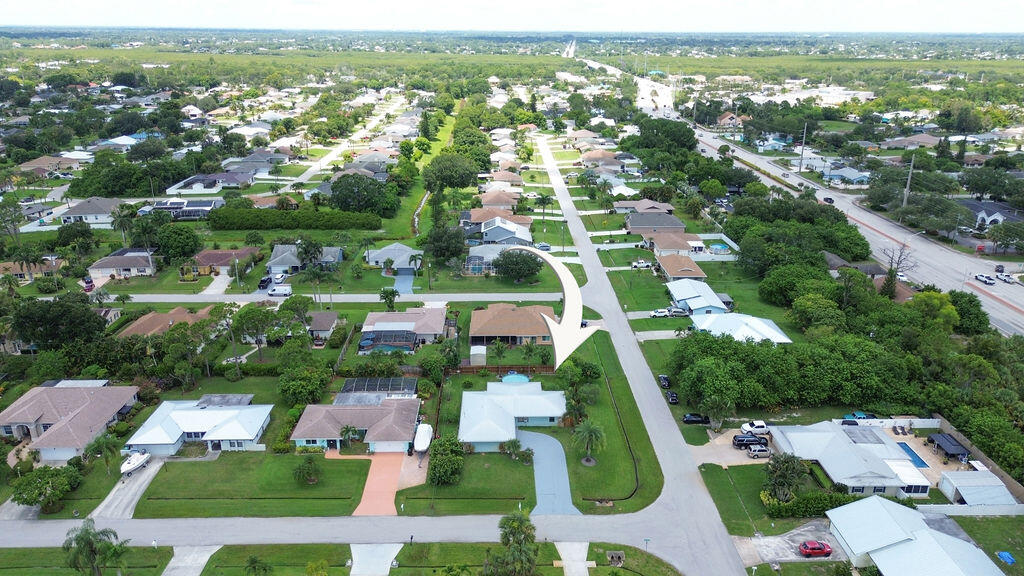 2402 Southeast Pinero Road Port St. Lucie, FL 34952 - Photo 17 of 45 an aerial view of residential houses with outdoor space and swimming pool